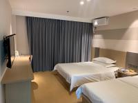 M Hotel Xiamen Haicang Maqing Road Metro Stationにあるベッド