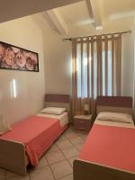 A bed or beds in a room at LA CASA TRA GLI ULIVI