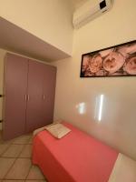 A bed or beds in a room at LA CASA TRA GLI ULIVI