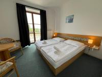 Łóżko lub łóżka w pokoju w obiekcie Hotel Sloup
