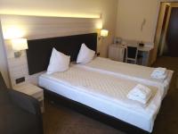 Łóżko lub łóżka w pokoju w obiekcie Spa Hotel Gloria