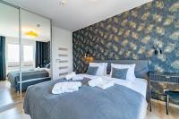 Posteľ alebo postele v izbe v ubytovaní Apartament MEDALLION