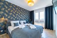 Posteľ alebo postele v izbe v ubytovaní Apartament MEDALLION