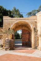 an entrance to a stone building with a wooden door at Antica Masseria Martuccio in Mesagne