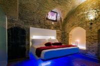 A bed or beds in a room at Inferno e Paradiso