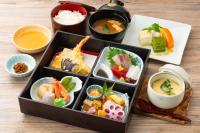 a tray of different types of food on a table at Hill Hotel Sunpia Iga in Iga