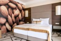 Postel nebo postele na pokoji v ubytování Ambient Hotel & Thermal Spa