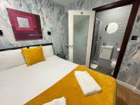 Postel nebo postele na pokoji v ubytování ND Hotel - Hyde Park