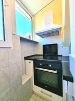 Kuchyň nebo kuchyňský kout v ubytování Two-Floor Sunny Apartment in City Centre