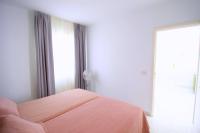 A bed or beds in a room at Apartamentos Corona Mar