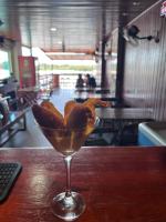 een martiniglas met brood erin op een tafel bij Pousada Seven Sunset Club Marambaia in Rio de Janeiro