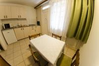 A kitchen or kitchenette at Solar Club Apartman Sopron