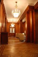 a hallway with a chandelier and chairs in a building at Shanghai Moller Villa Hotel - National Historic and Cultural Relics Protection Building in Shanghai