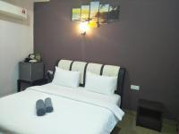 Ein Bett oder Betten in einem Zimmer der Unterkunft Red Coral Cottage