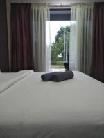 Ein Bett oder Betten in einem Zimmer der Unterkunft Red Coral Cottage