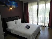 Ein Bett oder Betten in einem Zimmer der Unterkunft Red Coral Cottage