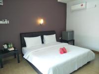 Ein Bett oder Betten in einem Zimmer der Unterkunft Red Coral Cottage