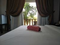 Ein Bett oder Betten in einem Zimmer der Unterkunft Red Coral Cottage