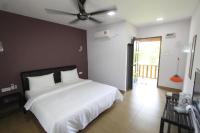 Ein Bett oder Betten in einem Zimmer der Unterkunft Red Coral Cottage