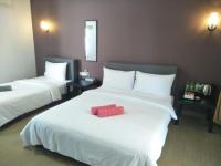 Ein Bett oder Betten in einem Zimmer der Unterkunft Red Coral Cottage