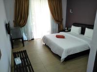Ein Bett oder Betten in einem Zimmer der Unterkunft Red Coral Cottage