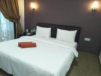 Ein Bett oder Betten in einem Zimmer der Unterkunft Red Coral Cottage
