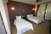 Ein Bett oder Betten in einem Zimmer der Unterkunft Red Coral Cottage
