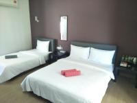 Ein Bett oder Betten in einem Zimmer der Unterkunft Red Coral Cottage