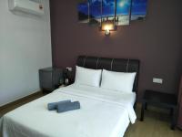 Ein Bett oder Betten in einem Zimmer der Unterkunft Red Coral Cottage