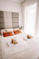 Łóżko lub łóżka w pokoju w obiekcie Partnerapart Rakowicka 14
