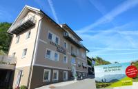 a building with a sign in front of it at Apartments Luidold in Schladming