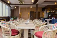 a long table and chairs in a restaurant at Hotel Mirage Regency in Kathmandu