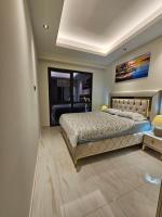 Postel nebo postele na pokoji v ubytování Cebeci Towers Luxury