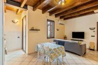 Televízia a/alebo spoločenská miestnosť v ubytovaní House Verona Zen