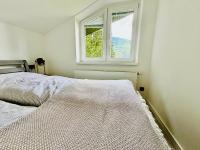Postel nebo postele na pokoji v ubytování Apartmány Panorama Harrachov
