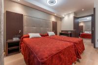 Postel nebo postele na pokoji v ubytování Hotel de La Trucha