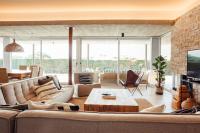 A television and/or entertainment centre at Villa Tramuntana Luxury Sea View Retreat - Cap d'en Font, Menorca