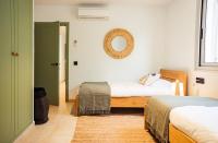 A bed or beds in a room at Villa Tramuntana Luxury Sea View Retreat - Cap d'en Font, Menorca