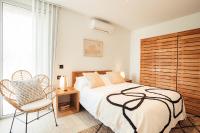 A bed or beds in a room at Villa Tramuntana Luxury Sea View Retreat - Cap d'en Font, Menorca