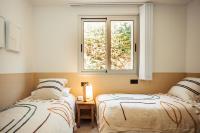 A bed or beds in a room at Villa Tramuntana Luxury Sea View Retreat - Cap d'en Font, Menorca
