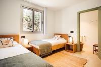 A bed or beds in a room at Villa Tramuntana Luxury Sea View Retreat - Cap d'en Font, Menorca