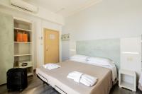 Posteľ alebo postele v izbe v ubytovaní Hotel Kim