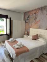 Postel nebo postele na pokoji v ubytování Casa Jardín El Colmenar