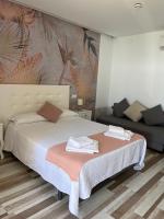 Postel nebo postele na pokoji v ubytování Casa Jardín El Colmenar
