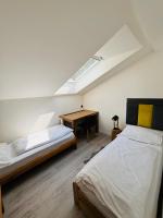 Postel nebo postele na pokoji v ubytování Apartmány Panorama Harrachov