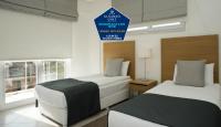 Postel nebo postele na pokoji v ubytování Kusadası Golf Spa Resort