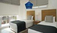 Postel nebo postele na pokoji v ubytování Kusadası Golf Spa Resort