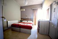 Posteľ alebo postele v izbe v ubytovaní Bikakis Family Apartments