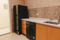 Kuchyň nebo kuchyňský kout v ubytování Signature Stays Breezy Modern Apt