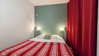 Łóżko lub łóżka w pokoju w obiekcie Appartement cosy 1 chambre 4 pers face pistes 08